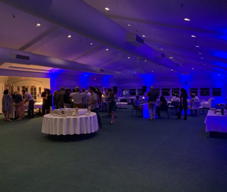 wedding venue setup with crowd gathered on dance floor